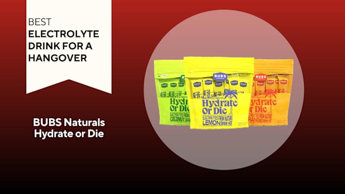 A red background with a banner reading "Best Electrolyte Drink for a Hangover" next to three orange, yellow, and green bags of BUBS Naturals Hydrate or Die electrolyte drink